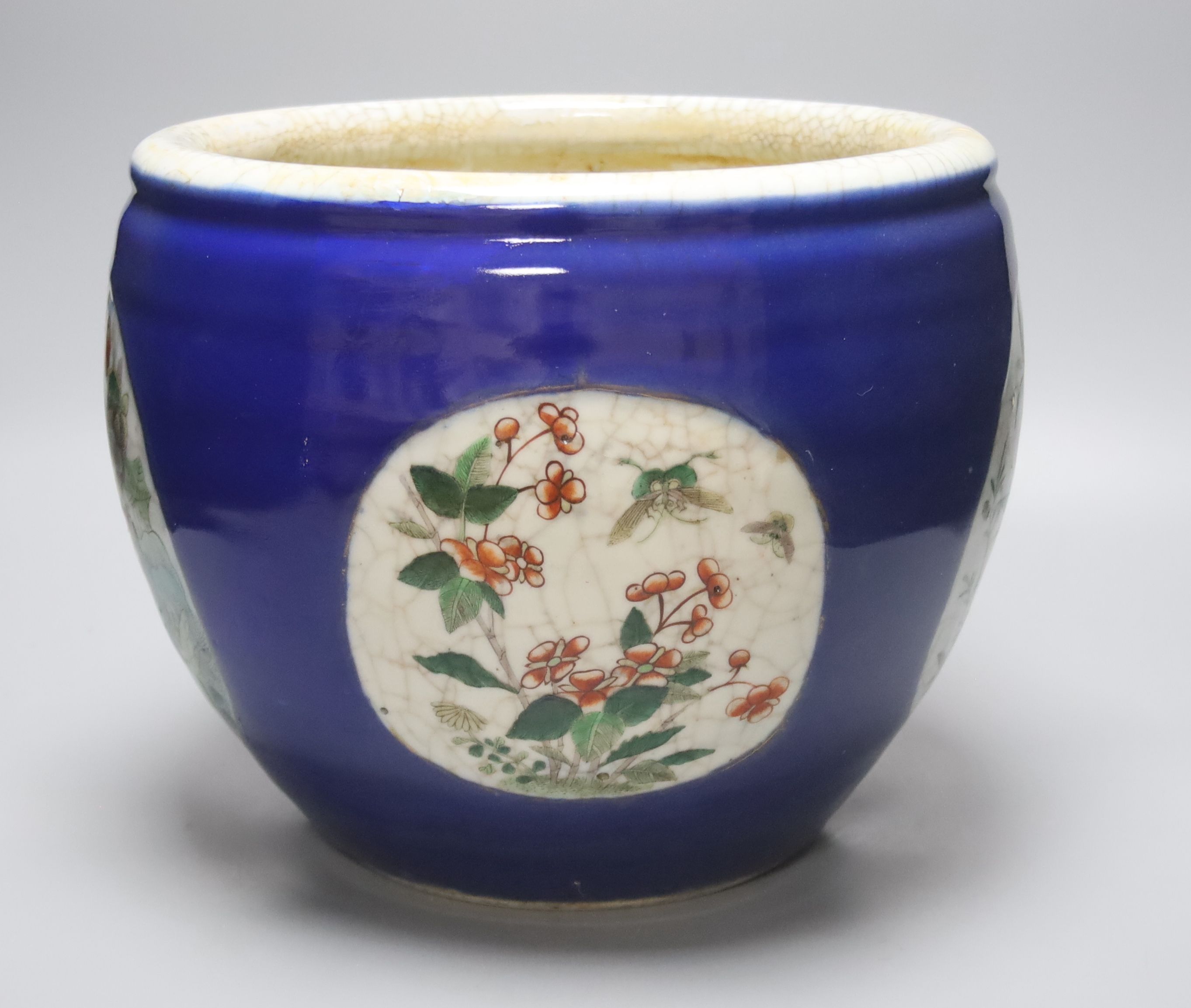 A large Chinese famille verte blue ground jardiniere, late 19th century, height 26cm